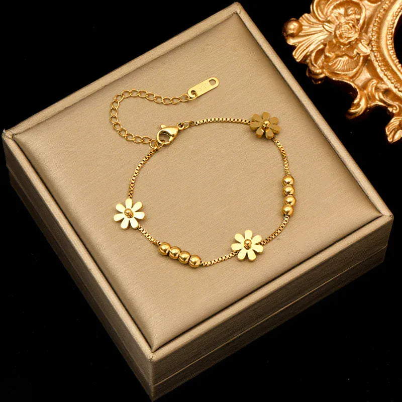 Pulseira de flor dourada